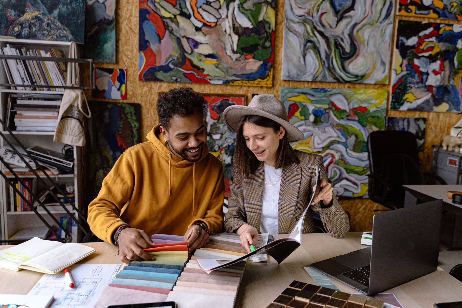Design consultation with material samples in a modern studio.
