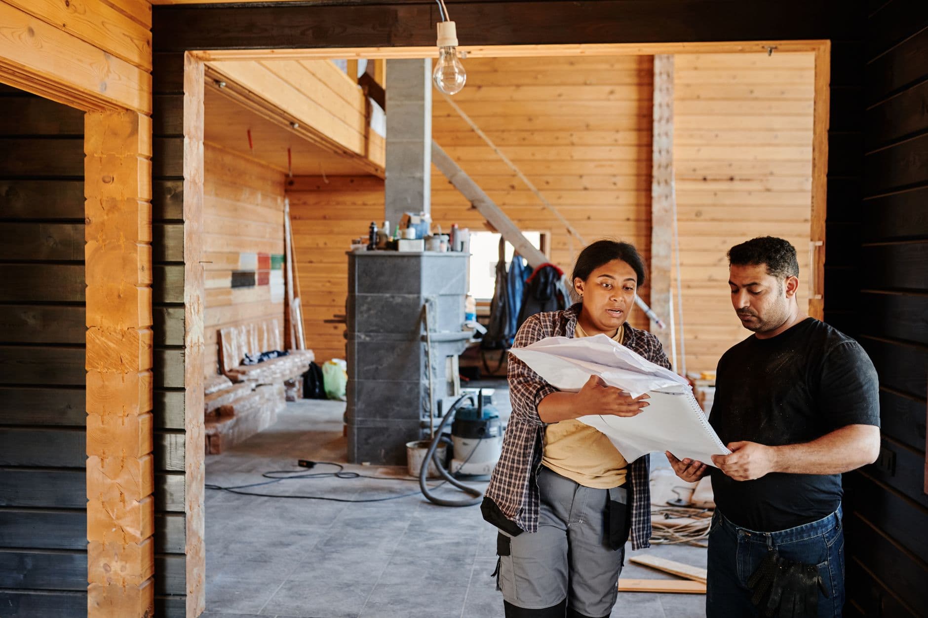 Project team reviewing plans at an active renovation site.